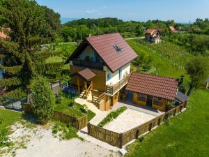an overhead view of a house with a roof at Kuća za odmor Holiday spa House Kostanjevec- Oaza mira ,bazen i spa in Velika Gorica