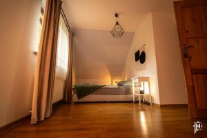a bedroom with a bed in the corner of a room at Majcia in Jelenia Góra +3 photos