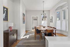 a kitchen and dining room with a table and chairs at Modern West End Townhome 3BR 2BA in Portland