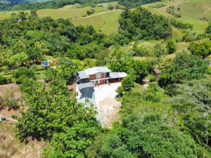 an aerial view of a house in the trees at Alma Silvestre in Puerto Triunfo