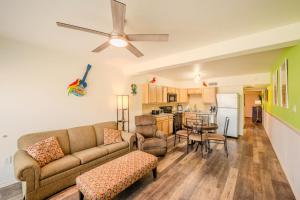 a living room with a couch and a table at Five O Clock Somewhere in Port Aransas