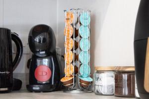 a group of oranges in a glass container next to a blender at The Forest Lodge, Glen Eagles. in Auchterarder +11 photos