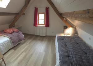 Postel nebo postele na pokoji v ubytování Gîte sainte Famille