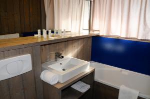 Vannituba majutusasutuses Hôtel Arcadien