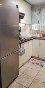 a kitchen with a stainless steel refrigerator at Casa Refugio Relajante in Pirque