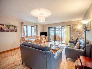 a living room with two couches and a dining room at 3 Bed in Dingle oc-ii05995 in Dingle