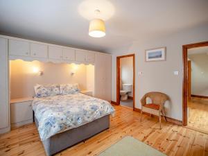 a bedroom with a bed and a chair in it at 3 Bed in Dingle oc-ii05995 in Dingle