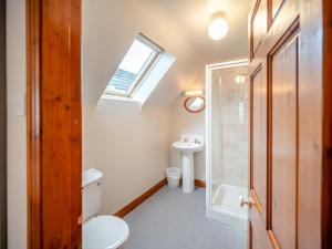 a bathroom with a toilet and a sink and a skylight at 3 Bed in Dingle oc-ii05995 in Dingle +12 photos