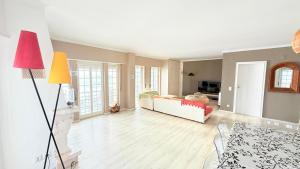a living room with a couch and a table at Atlantic Views Sintra Guest House in Colares
