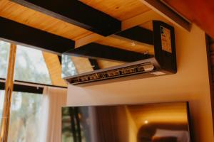 a ventilator hanging from the ceiling of a kitchen at Canaã Cabanas in Mariópolis