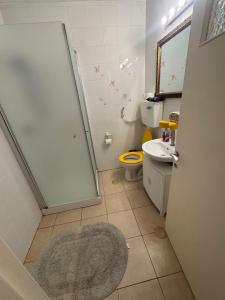 a bathroom with a shower and a toilet and a rug at צימר הר הגמל in Mitzpe Ramon +13 photos
