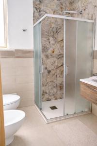 a bathroom with a shower and a toilet at My Home Lampedusa in Lampedusa