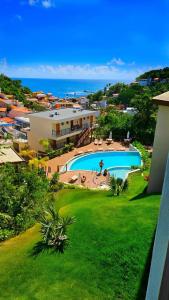 an aerial view of a resort with a swimming pool at Amerigo Exclusive in Morro de São Paulo