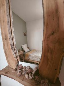 a room with a bed and a table with rocks at Hippie Chic - Room La Dune in Sidi Kaouki