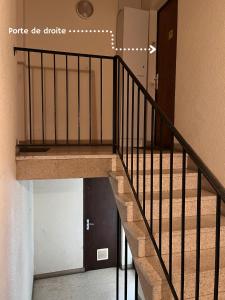 a staircase in a building with a stair railing at Biscalove in Biscarrosse +3 photos