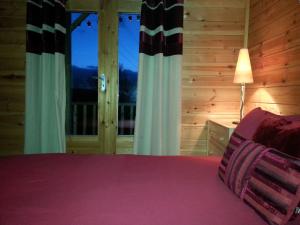 a bedroom with a bed and a window at Ironbridge Lodge in Ironbridge