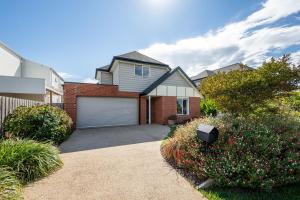 a house with a garage in a residential neighborhood at Parkside Breeze in Rosebud in Rosebud