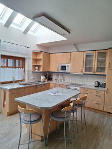 a kitchen with a table and chairs in it at Haus mit Seeblick in Fürstenau
