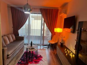a living room with a couch and a table at Focsani Studio Residence 3 in Focşani
