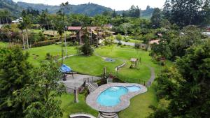 an aerial view of a park with a swimming pool at Matisses Hotel & Spa in Santa Rosa de Cabal