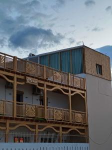 a building with a deck on the side of it at Classic Home DaHaB in Dahab