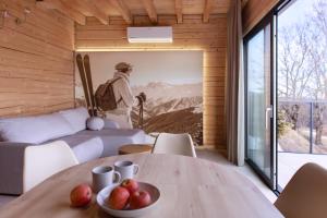 a room with a table with a bowl of fruit on it at Góry i Chmury in Duszniki Zdrój +20 photos