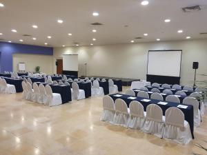 a large room with rows of chairs and a screen at Hotel Bello Veracruz in Veracruz +17 photos