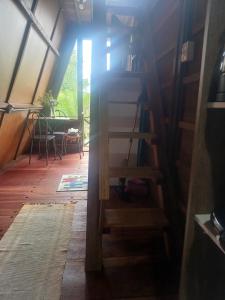 an inside view of a room with a table and a window at Chalé Garças in Chapada dos Guimarães