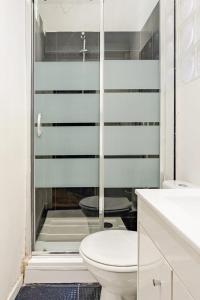 a bathroom with a toilet and a glass shower at Duplex 2chambres avec Terrasse Centre Historique in Fréjus +19 photos