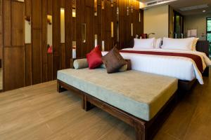 En eller flere senger på et rom på Aonang Phu Pi Maan Resort & Spa