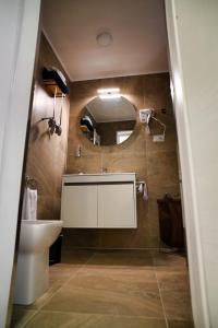 a bathroom with a sink and a mirror at La Casa del Faro in Taranto +36 photos