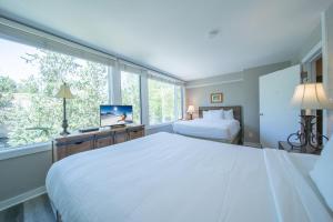 a bedroom with two beds and a large window at Argentine 1511 by SummitCove Lodging in Colorado in Keystone +39 photos