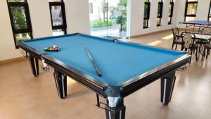 a blue pool table in a room with at Noble Grand Villa in Mahabalipuram