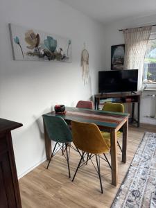 a dining room with a wooden table and chairs at Viva la Wildbad in Bad Wildbad