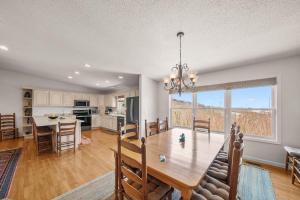 a dining room and kitchen with a table and chairs at Oma's Beech House in Beech Mountain
