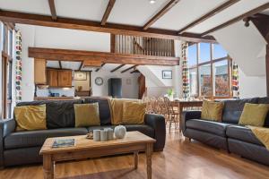a living room with a couch and a table at 4 Bed in Newport oc-88913 in Porchfield