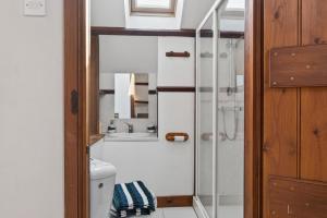 a bathroom with a shower and a toilet at 4 Bed in Newport oc-88913 in Porchfield +27 photos