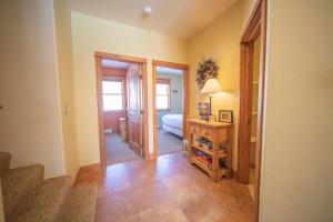 a room with a bathroom with a toilet and a mirror at Antlers Gulch 303 by SummitCove Lodging in Colorado in Keystone