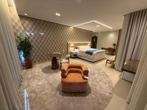 a bedroom with a bed and a couch in a room at Hotel London Santarem in Santarém +50 photos