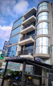 a hotel building with a hotel sign on it at ArisSha Boutique Hotel in Cali