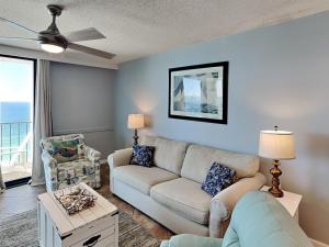 a living room with a couch and a ceiling fan at Phoenix III #3146 in Orange Beach