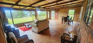a living room with a couch and a table at Finca El Recuerdo in Guatavita