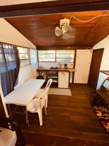 a kitchen with a table and chairs in a trailer at Noni garden apartment in Tamarindo