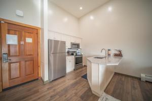 a kitchen with a stainless steel refrigerator and a counter at Buffalo Lodge 8412 by SummitCove Lodging in Colorado in Keystone +71 photos