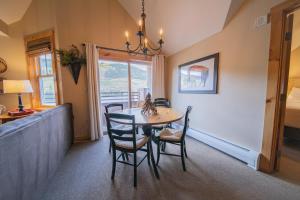 a dining room with a table and chairs at Buffalo Lodge 8411 by SummitCove Lodging in Colorado in Keystone
