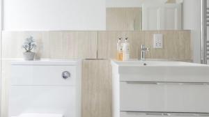 a bathroom with two white sinks and a mirror at Whitecraigs in Elgin +30 photos