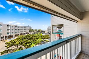 a balcony with a view of the beach at Heated Pool Beach View Beachside Haven Balcony in Galveston