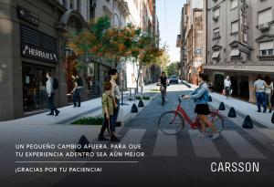 a poster of people walking down a city street at Carsson Hotel Downtown Buenos Aires in Buenos Aires