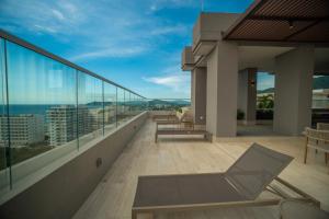a balcony with a view of the ocean at Refugio Del Mar Bello Horizonte Playa Dormida in Santa Marta