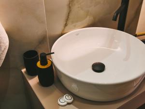 a bathroom with a white sink on a counter at Marilion Villa in Ioannina +24 photos